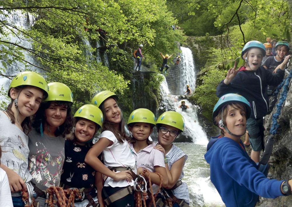 Group waiting to jump on a zip line in an adventure park